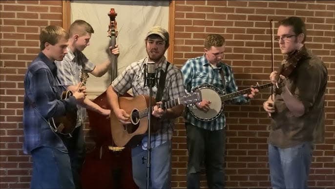 The Canoe Ridge Boys bluegrass band performing with guitar, banjo, fiddle, mandolin, and upright bass